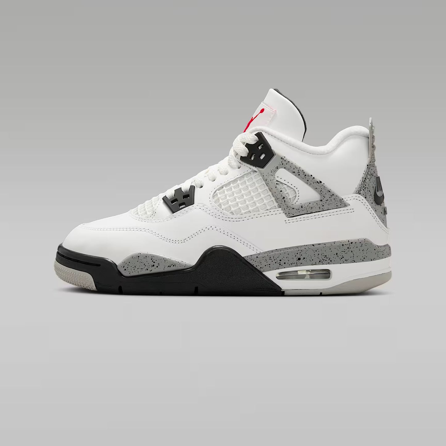 White sneaker with gray and black accents on a gray background