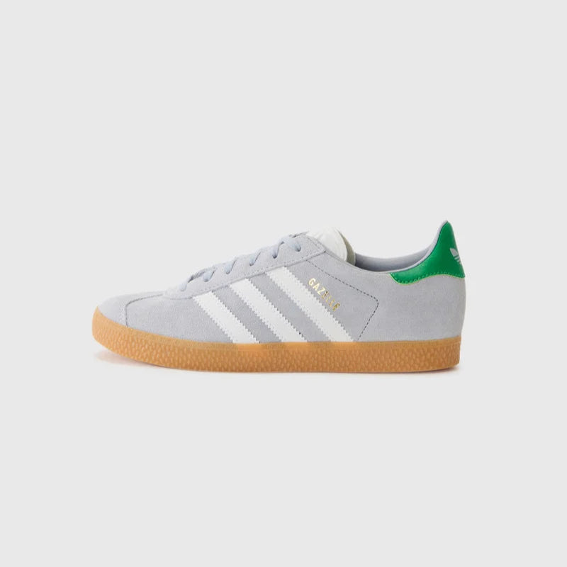 Gray Adidas sneaker with green accents on a white background